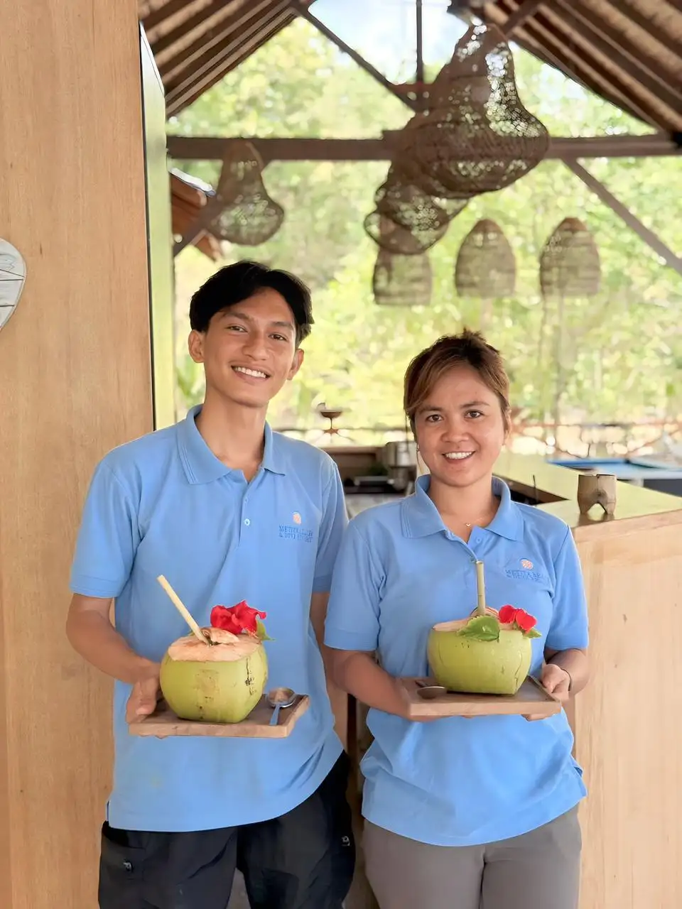 Male and female servers at the Lotus Metita Island restaurant